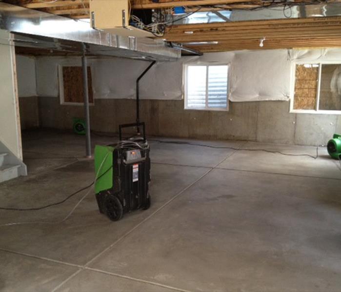 Room with tile floor and one large piece of SERVPRO equipment.