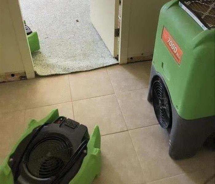 Two air movers on tile and one on carpet. 