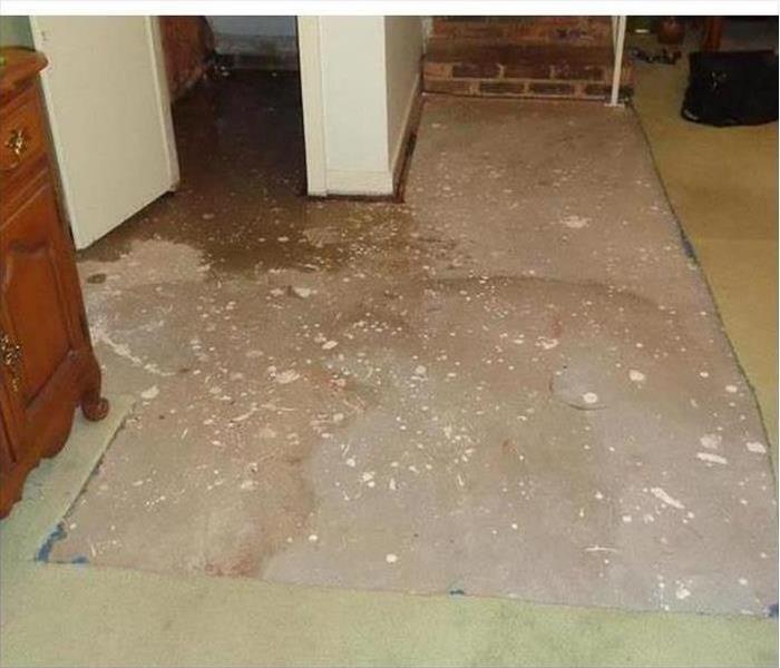Carpet has been removed, wet floor. Concept of water damage.