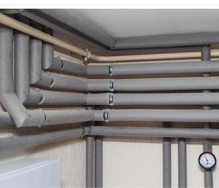 Isolation ducts and pressure gauges flow and return pipes in the boiler room of a private house
