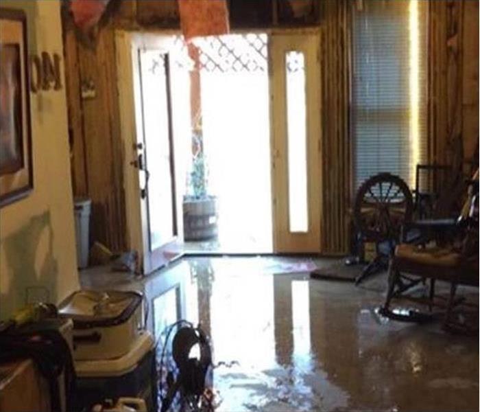 Water inside a living room, flooded living room, standing water on living room